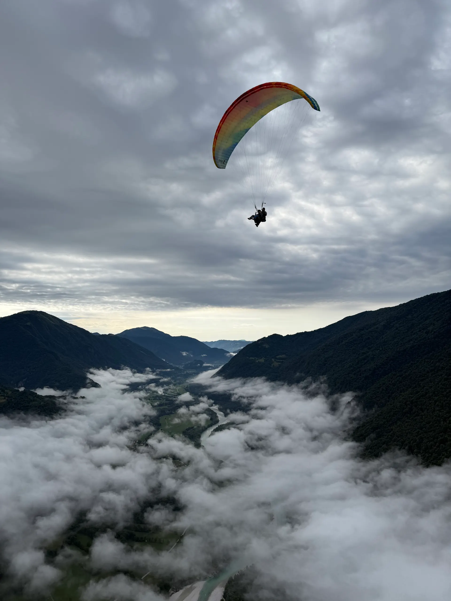 Tandem paraglider high in the northern Julian Alps near Mangart