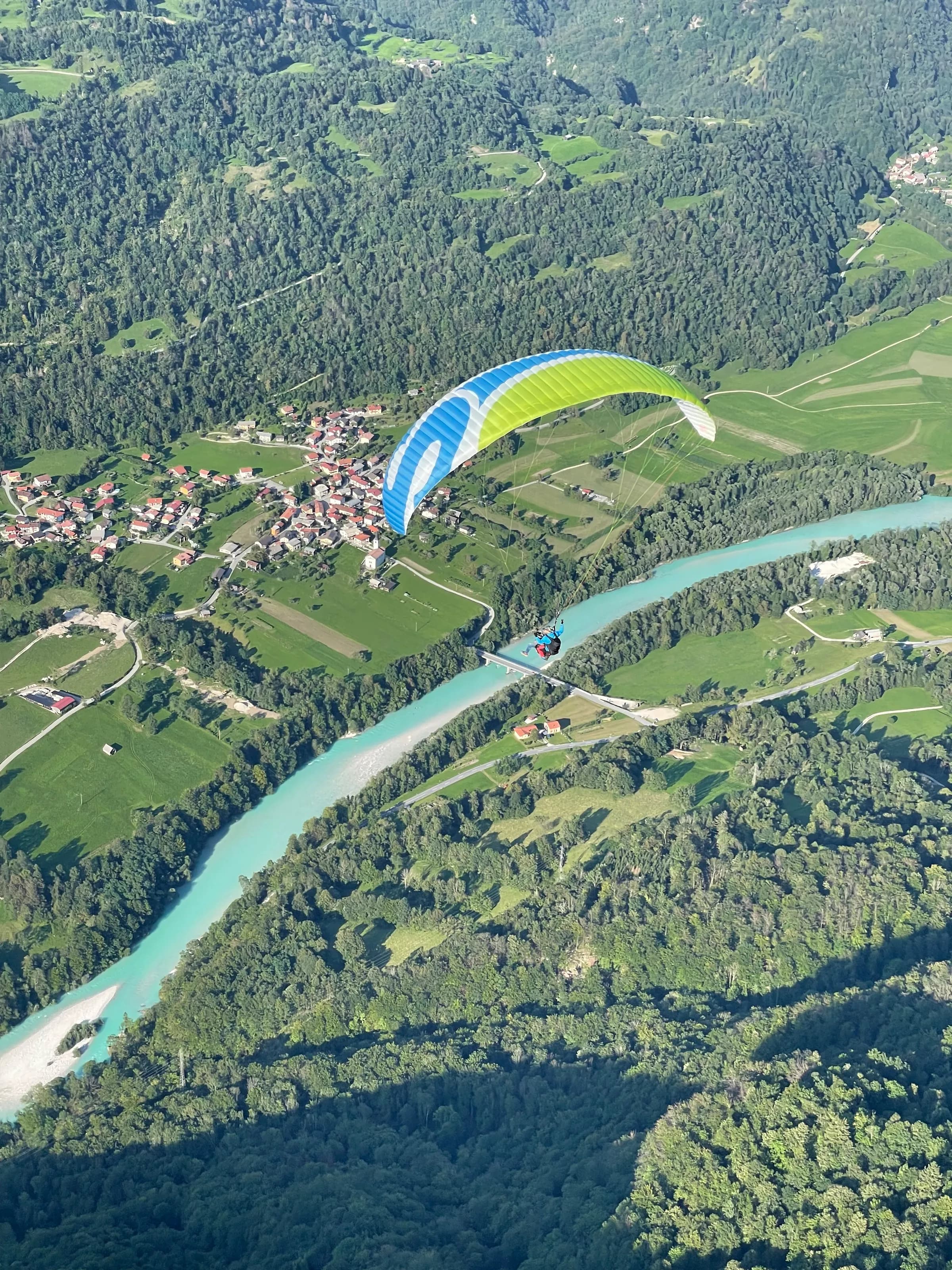 Paraglider over the emerald Soča river near Kobarid